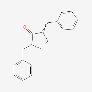 molecular formula C19H18O B14447470 Cyclopentanone, 2-(phenylmethyl)-5-(phenylmethylene)- CAS No. 74152-33-3