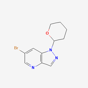 molecular formula C11H12BrN3O B1446194 6-Bromo-1-(tetrahydro-2H-pyran-2-yl)-1H-pyrazolo[4,3-b]pyridine CAS No. 1416713-01-3