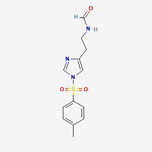 molecular formula C13H15N3O3S B14470850 N-{2-[1-(4-Methylbenzene-1-sulfonyl)-1H-imidazol-4-yl]ethyl}formamide CAS No. 66398-00-3
