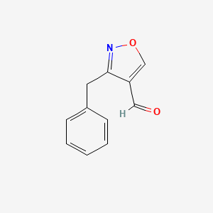molecular formula C11H9NO2 B1447974 3-Benzyl-1,2-oxazole-4-carbaldehyde CAS No. 1312540-61-6
