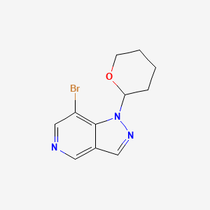 molecular formula C11H12BrN3O B1448920 7-Bromo-1-(tetrahydro-2H-pyran-2-yl)-1H-pyrazolo[4,3-c]pyridine CAS No. 1416712-42-9