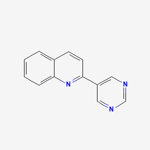 molecular formula C13H9N3 B14491098 Quinoline, 2-(5-pyrimidinyl)- CAS No. 64858-31-7