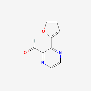 molecular formula C9H6N2O2 B1450509 3-(呋喃-2-基)吡嗪-2-甲醛 CAS No. 1823498-75-4