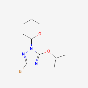 molecular formula C10H16BrN3O2 B1450565 3-Bromo-5-isopropoxy-1-(tetrahydro-2H-pyran-2-yl)-1H-1,2,4-triazole CAS No. 1630905-12-2