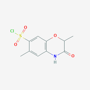molecular formula C10H10ClNO4S B1450895 2,6-二甲基-3-氧代-3,4-二氢-2H-苯并[b][1,4]恶嗪-7-磺酰氯 CAS No. 1171749-11-3