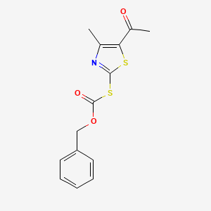 molecular formula C14H13NO3S2 B14513223 Carbonothioic acid, S-(5-acetyl-4-methyl-2-thiazolyl) O-(phenylmethyl) ester CAS No. 63148-79-8