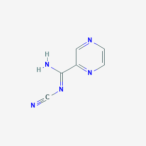 molecular formula C6H5N5 B1453349 N'-Cyanopyrazine-2-carboximidamide CAS No. 1053656-81-7