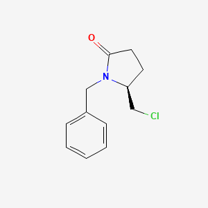 molecular formula C12H14ClNO B1456813 (S)-1-Benzyl-5-chloromethyl-2-pyrrolidinone CAS No. 1272755-05-1