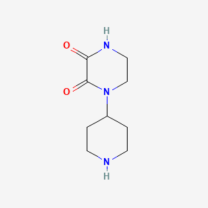 molecular formula C9H15N3O2 B1457701 1-(Piperidin-4-yl)piperazine-2,3-dione CAS No. 1446407-30-2