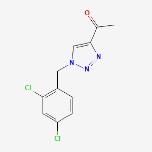 molecular formula C11H9Cl2N3O B1458210 1-{1-[(2,4-dichlorophenyl)methyl]-1H-1,2,3-triazol-4-yl}ethan-1-one CAS No. 1443291-27-7