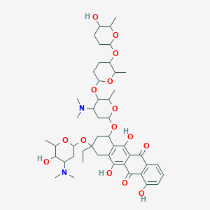 molecular formula C48H68N2O15 B145837 9-[4-(dimethylamino)-5-hydroxy-6-methyloxan-2-yl]oxy-7-[4-(dimethylamino)-5-[5-(5-hydroxy-6-methyloxan-2-yl)oxy-6-methyloxan-2-yl]oxy-6-methyloxan-2-yl]oxy-9-ethyl-1,6,11-trihydroxy-8,10-dihydro-7H-tetracene-5,12-dione CAS No. 133914-58-6