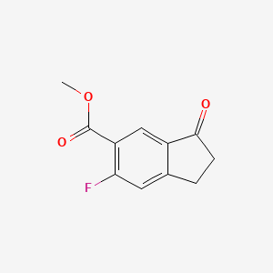 molecular formula C11H9FO3 B1458568 Methyl 6-fluoro-3-oxo-2,3-dihydro-1H-indene-5-carboxylate CAS No. 1273651-10-7