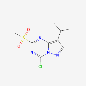 molecular formula C9H11ClN4O2S B1459569 4-Chloro-8-isopropyl-2-(methylsulfonyl)pyrazolo[1,5-a][1,3,5]triazine CAS No. 1453836-38-8