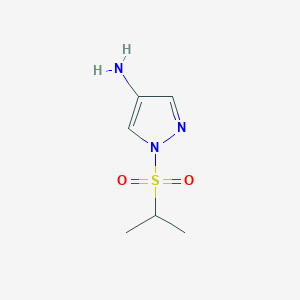 molecular formula C6H11N3O2S B1459759 1-(Propane-2-sulfonyl)-1H-pyrazol-4-amine CAS No. 1934771-14-8