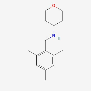 N-[(2,4,6-trimethylphenyl)methyl]oxan-4-amine