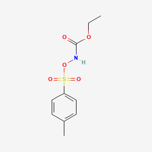 molecular formula C10H13NO5S B14629712 Carbamic acid, [[(4-methylphenyl)sulfonyl]oxy]-, ethyl ester CAS No. 54145-10-7