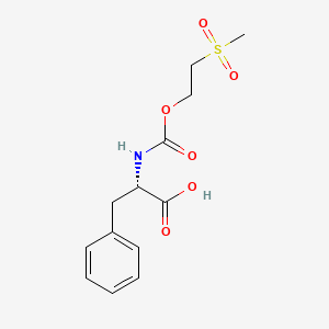 molecular formula C13H17NO6S B14638375 N-{[2-(Methanesulfonyl)ethoxy]carbonyl}-L-phenylalanine CAS No. 55657-60-8