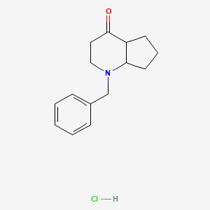 molecular formula C15H20ClNO B1465034 1-Benzyloctahydro-4H-cyclopenta[b]pyridin-4-one hydrochloride CAS No. 1217049-30-3