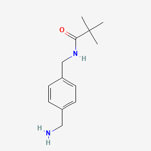 molecular formula C13H20N2O B1465312 4-[(2,2-Dimethyl-propionylamino)-methyl]-benzylamine CAS No. 928649-28-9