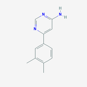 molecular formula C12H13N3 B1466767 6-(3,4-Dimethylphenyl)pyrimidin-4-amine CAS No. 1368657-87-7