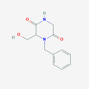 molecular formula C12H14N2O3 B1468173 1-Benzyl-6-(hydroxymethyl)-2,5-piperazinedione CAS No. 1353497-53-6
