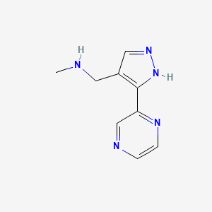 molecular formula C9H11N5 B1470138 N-methyl-1-(3-(pyrazin-2-yl)-1H-pyrazol-4-yl)methanamine CAS No. 1510459-57-0