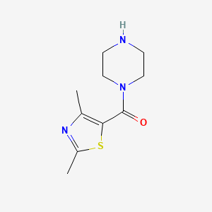 molecular formula C10H15N3OS B1470790 1-(2,4-Dimethyl-1,3-thiazole-5-carbonyl)piperazine CAS No. 1225734-03-1