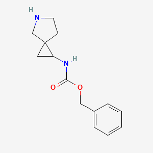 molecular formula C14H18N2O2 B1473324 benzyl N-{5-azaspiro[2.4]heptan-1-yl}carbamate CAS No. 1419101-05-5