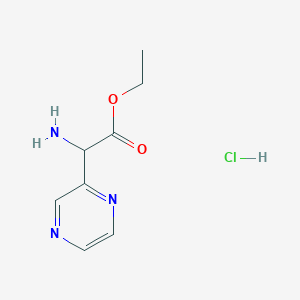 molecular formula C8H12ClN3O2 B1473627 Ethyl 2-amino-2-(pyrazin-2-yl)acetate hydrochloride CAS No. 159470-82-3