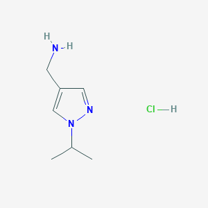 molecular formula C7H14ClN3 B1473838 [(1-Isopropyl-1H-pyrazol-4-yl)methyl]amine hydrochloride CAS No. 1609403-88-4