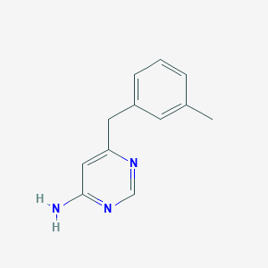 6-[(3-Methylphenyl)methyl]pyrimidin-4-amine