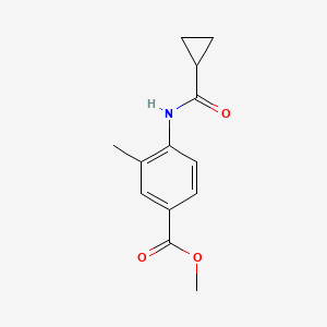 molecular formula C13H15NO3 B14913411 Methyl 4-(cyclopropanecarboxamido)-3-methylbenzoate 