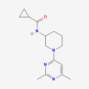 molecular formula C15H22N4O B15122316 N-[1-(2,6-dimethylpyrimidin-4-yl)piperidin-3-yl]cyclopropanecarboxamide 