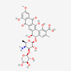molecular formula C37H39NO17 B15190992 Benzo(a)naphthacene-2-carboxylic acid, 5-((4,6-dideoxy-4-(methylamino)-3-O-beta-D-xylopyranosyl-beta-D-galactopyranosyl)oxy)-5,6,8,13-tetrahydro-1,6,9,14-tetrahydroxy-11-methoxy-3-methyl-8,13-dioxo-, (5S-trans)- CAS No. 148677-13-8