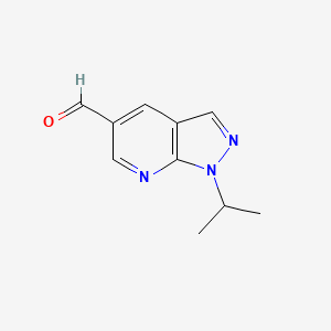 molecular formula C10H11N3O B1520718 1-(propan-2-yl)-1H-pyrazolo[3,4-b]pyridine-5-carbaldehyde CAS No. 1240526-52-6