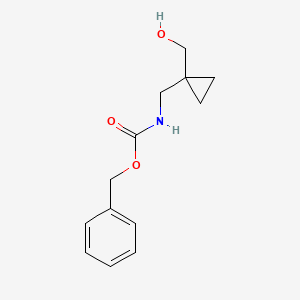 molecular formula C13H17NO3 B1520814 benzyl N-{[1-(hydroxymethyl)cyclopropyl]methyl}carbamate CAS No. 1323557-45-4