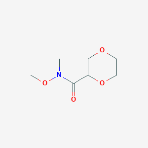 molecular formula C7H13NO4 B1526170 N-methoxy-N-methyl-1,4-dioxane-2-carboxamide CAS No. 1214900-98-7
