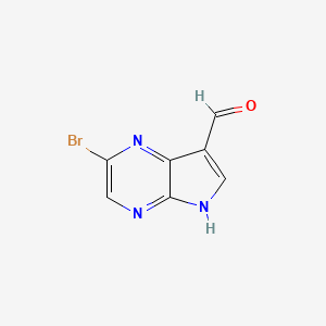 molecular formula C7H4BrN3O B1527668 2-Bromo-5H-pyrrolo[2,3-B]pyrazine-7-carbaldehyde CAS No. 1185428-32-3