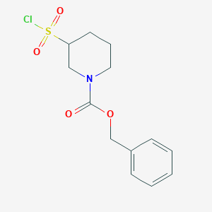B1527917 Benzyl 3-(chlorosulfonyl)piperidine-1-carboxylate CAS No. 1311317-42-6