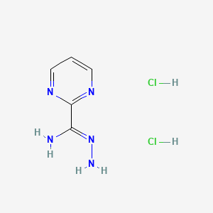 molecular formula C5H9Cl2N5 B1528240 N-aminopyrimidine-2-carboximidamide dihydrochloride CAS No. 1803585-11-6