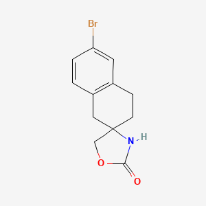 molecular formula C12H12BrNO2 B1528488 6-bromo-3,4-dihydro-1H-spiro[naphthalene-2,3'-[1,4]oxazolidine]-5'-one CAS No. 1489572-93-1