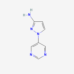 molecular formula C7H7N5 B1528521 1-(pyrimidin-5-yl)-1H-pyrazol-3-amine CAS No. 1367992-26-4