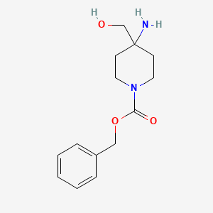 molecular formula C14H20N2O3 B1529077 Benzyl 4-amino-4-(hydroxymethyl)piperidine-1-carboxylate CAS No. 1262412-22-5