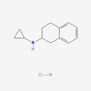 molecular formula C13H18ClN B1529128 Cyclopropyl-(1,2,3,4-tetrahydro-naphthalen-2-yl)-amine hydrochloride 