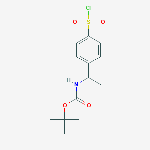 molecular formula C13H18ClNO4S B15298942 tert-butyl N-{1-[4-(chlorosulfonyl)phenyl]ethyl}carbamate 