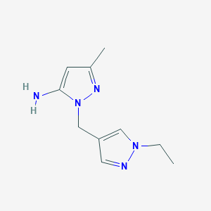 molecular formula C10H15N5 B1530603 1-[(1-ethyl-1H-pyrazol-4-yl)methyl]-3-methyl-1H-pyrazol-5-amine CAS No. 1415719-24-2