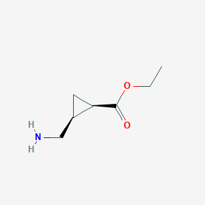 molecular formula C7H13NO2 B15318226 rac-ethyl (1R,2S)-2-(aminomethyl)cyclopropane-1-carboxylate 