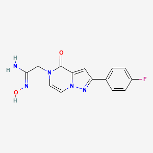 molecular formula C14H12FN5O2 B1532359 (1Z)-2-[2-(4-fluorophenyl)-4-oxopyrazolo[1,5-a]pyrazin-5(4H)-yl]-N'-hydroxyethanimidamide CAS No. 1255791-17-3