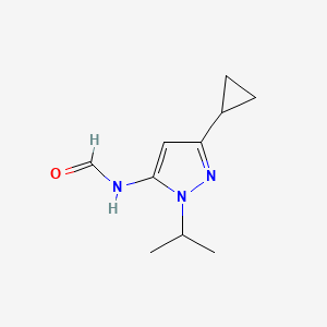 molecular formula C10H15N3O B15357977 N-(5-cyclopropyl-2-propan-2-ylpyrazol-3-yl)formamide 