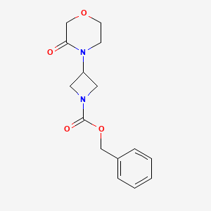 molecular formula C15H18N2O4 B15364722 Benzyl 3-(3-oxomorpholino)azetidine-1-carboxylate 